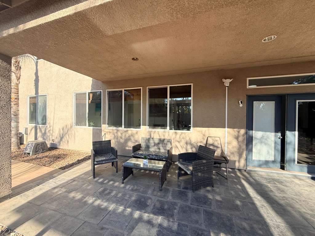Covered backyard seating at the SafeCoLV home